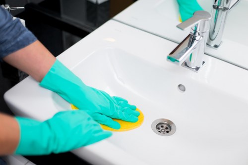 Carpet cleaners following health and safety procedures